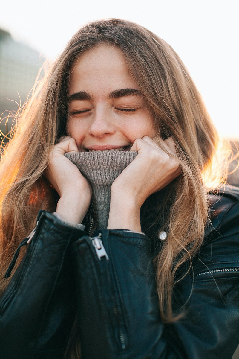 Cheerful woman embracing life's uncertainties